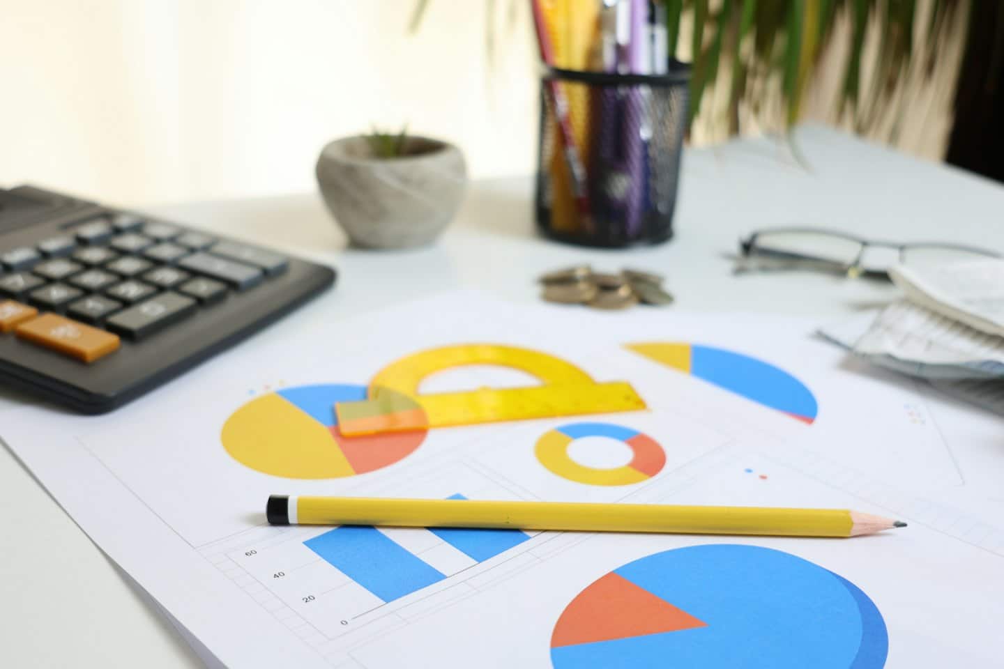 Desk with financial documents and office supplies for planning.